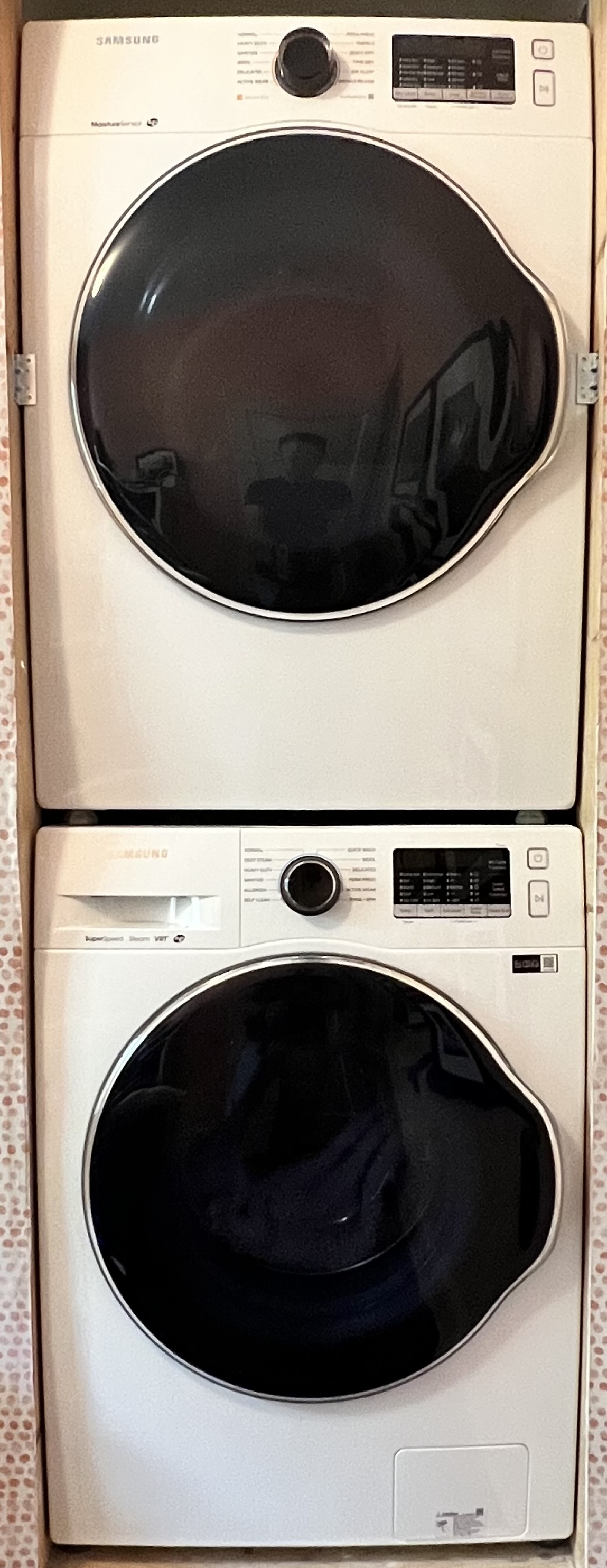 Samsung washer and dryer on the bedroom floor